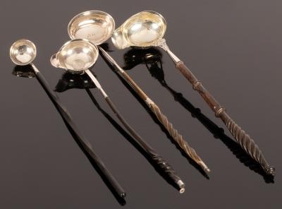 Four silver toddy ladles of various