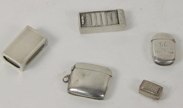 Four silver vesta cases and a