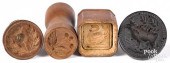 FOUR SMALL CARVED MAPLE BUTTER