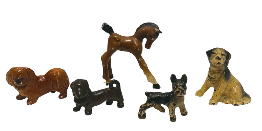 FOUR SMALL CAST IRON DOGS BY