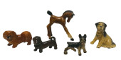FOUR SMALL CAST IRON DOGS BY H