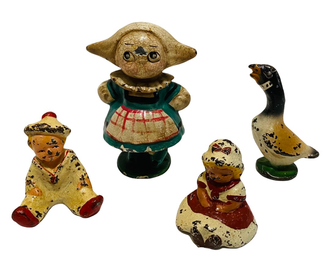 FOUR SMALL CAST IRON FIGURES BY