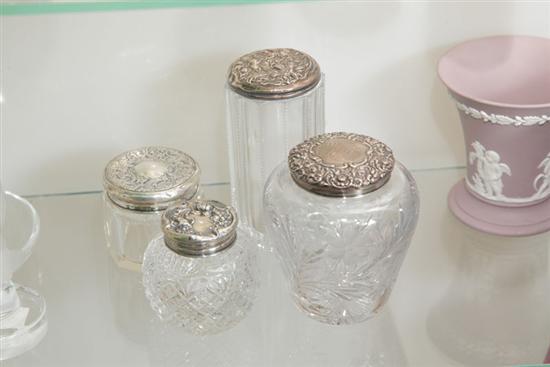 FOUR SMALL GLASS DRESSER JARS