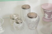 FOUR SMALL GLASS DRESSER JARS