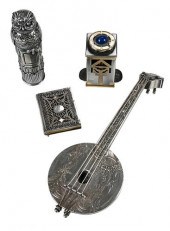 FOUR SMALL SILVER OBJECTSinclu