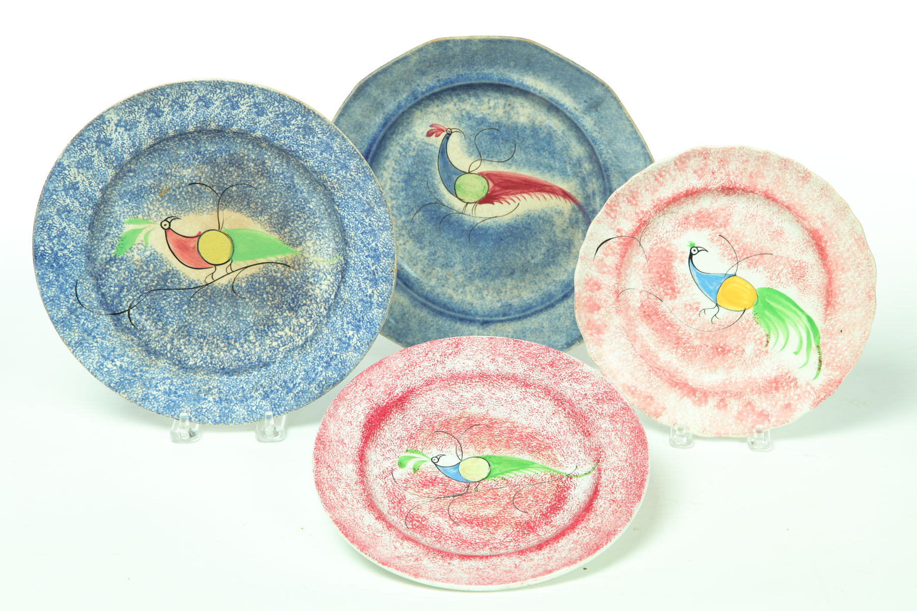 FOUR SPATTERWARE PLATES. 