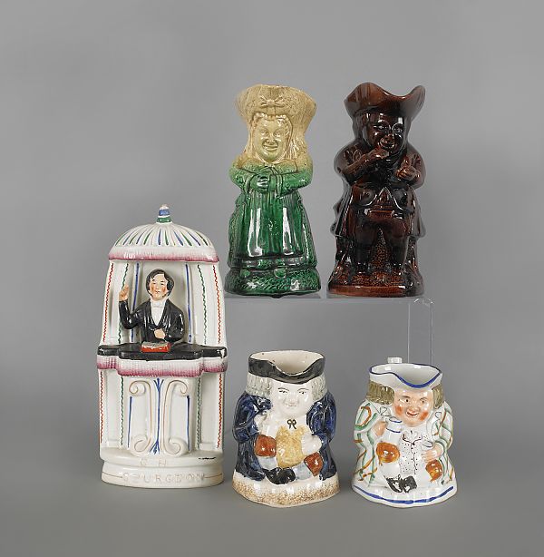 Four Staffordshire Toby pitchers