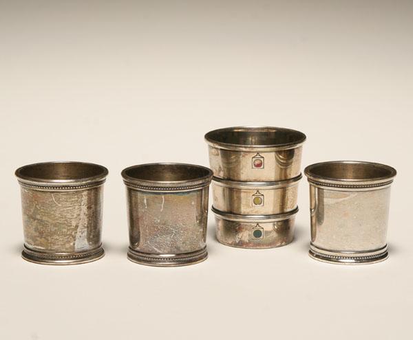 Four sterling jiggers including