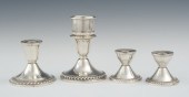 Four Sterling Silver Candlesti