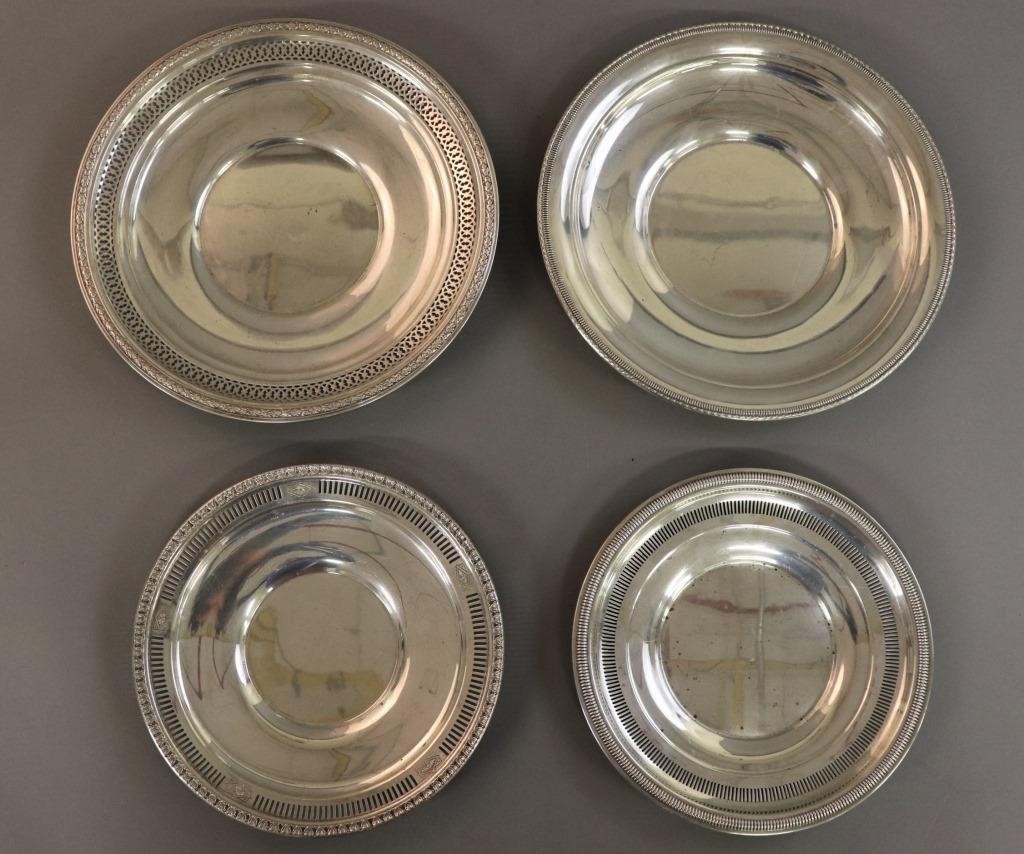 Four sterling silver plates,