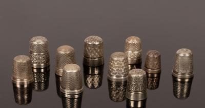 Four sterling silver thimbles,