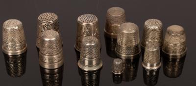 Four sterling silver thimbles,