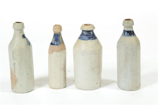 FOUR STONEWARE BOTTLES. 