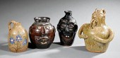FOUR STONEWARE FIGURAL JUGSFou