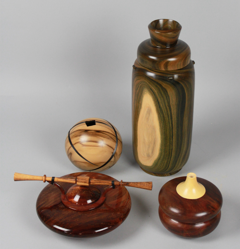 FOUR STRIATED HANDCRAFTED WOODEN