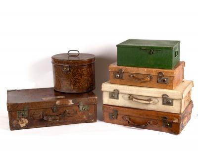 Four suitcases, a hat box and a