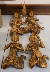 FOUR THAI GILT AND JEWELED WOO