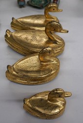 FOUR THAI GRADUATED GILT AND B