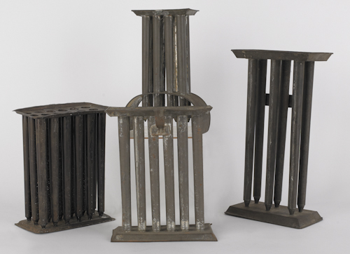 Four tin candlemolds 19th c.