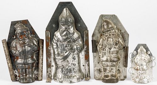 FOUR TIN CHRISTMAS SANTA CLAUS