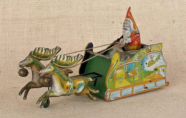 Four tin toy washing machines 8" h.