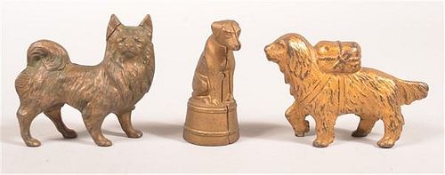FOUR VARIOUS CAST IRON DOG STILL