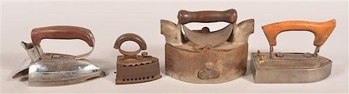 FOUR VARIOUS FLAT IRONS.Four