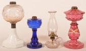 FOUR VARIOUS GLASS FLUID LAMPS