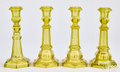 FOUR VASELINE GLASS CANDLESTIC