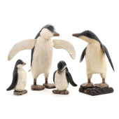 FOUR VINTAGE CARVED WOOD PENGU