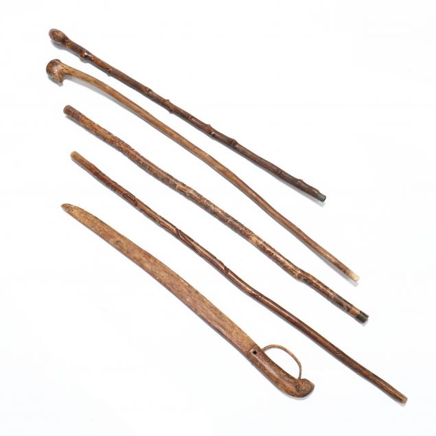 FOUR VINTAGE FOLK ART CANES AND A