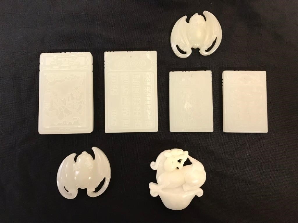 Four white Chinese plaques, largest