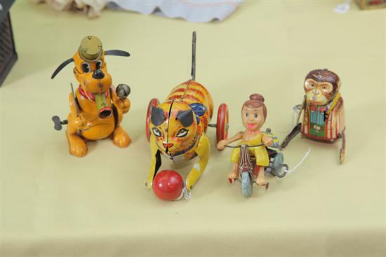 FOUR WIND-UP TOYS. Tin lithographed