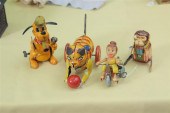 FOUR WIND-UP TOYS. Tin lithogr
