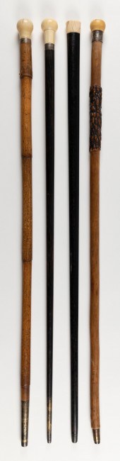 FOUR WOOD CANES WITH WHALE IVO