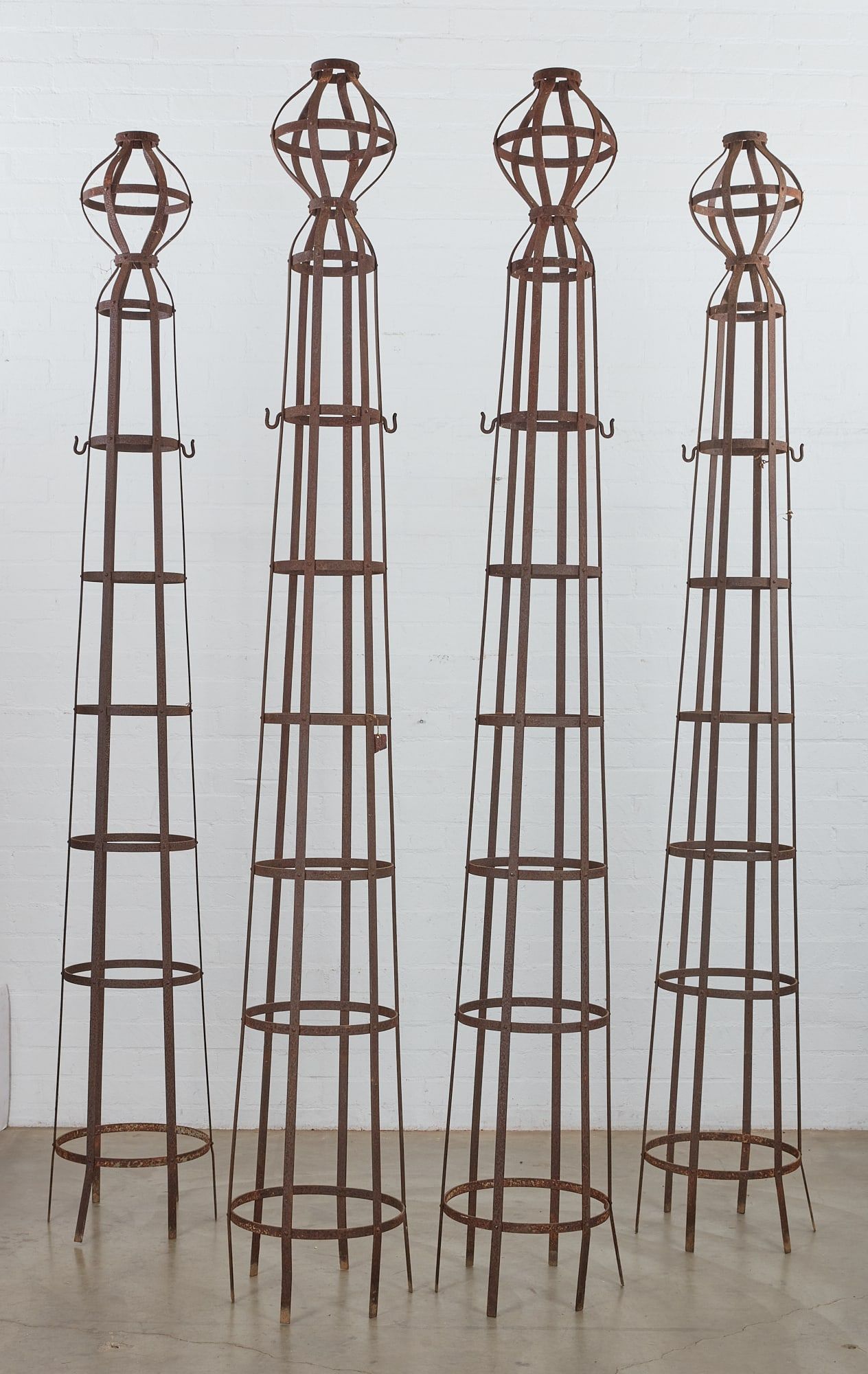 FOUR WROUGHT IRON ROUND OBELISK