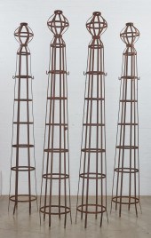 FOUR WROUGHT IRON ROUND OBELIS