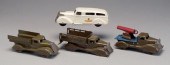Four Wyandotte trucks: white a