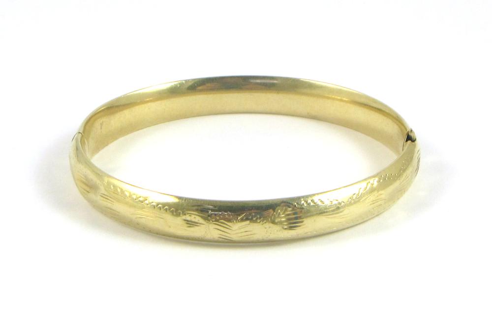 FOURTEEN KARAT GOLD BANGLE,