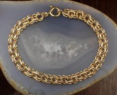 FOURTEEN KARAT GOLD CHAIN BRAC