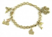 FOURTEEN KARAT GOLD CHARM BRAC