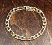FOURTEEN KARAT GOLD FIGARO CHA