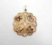 FOURTEEN KARAT GOLD QUADRUPLE