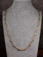 FOURTEEN KARAT YELLOW GOLD DOL
