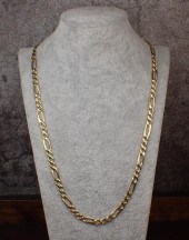 FOURTEEN KARAT YELLOW GOLD FIG