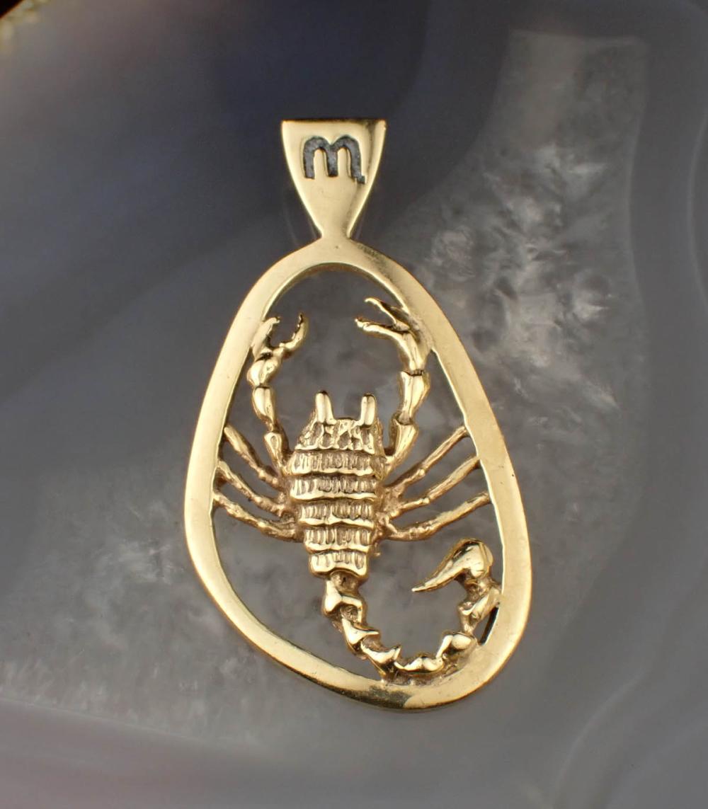 FOURTEEN KARAT YELLOW GOLD ZODIAC