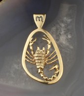 FOURTEEN KARAT YELLOW GOLD ZOD