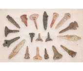 Frame of 19 flint drills.  Lar