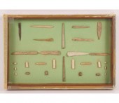 Frame of 28 bone and shell awl