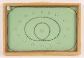 Frame of shell beads and glass